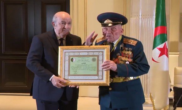 President Tebboune bestows the Order of the Partner to the friend of the revolution, Andriyko Lovech-Bavenko - Al-Hiwar Al-Jazaeryia